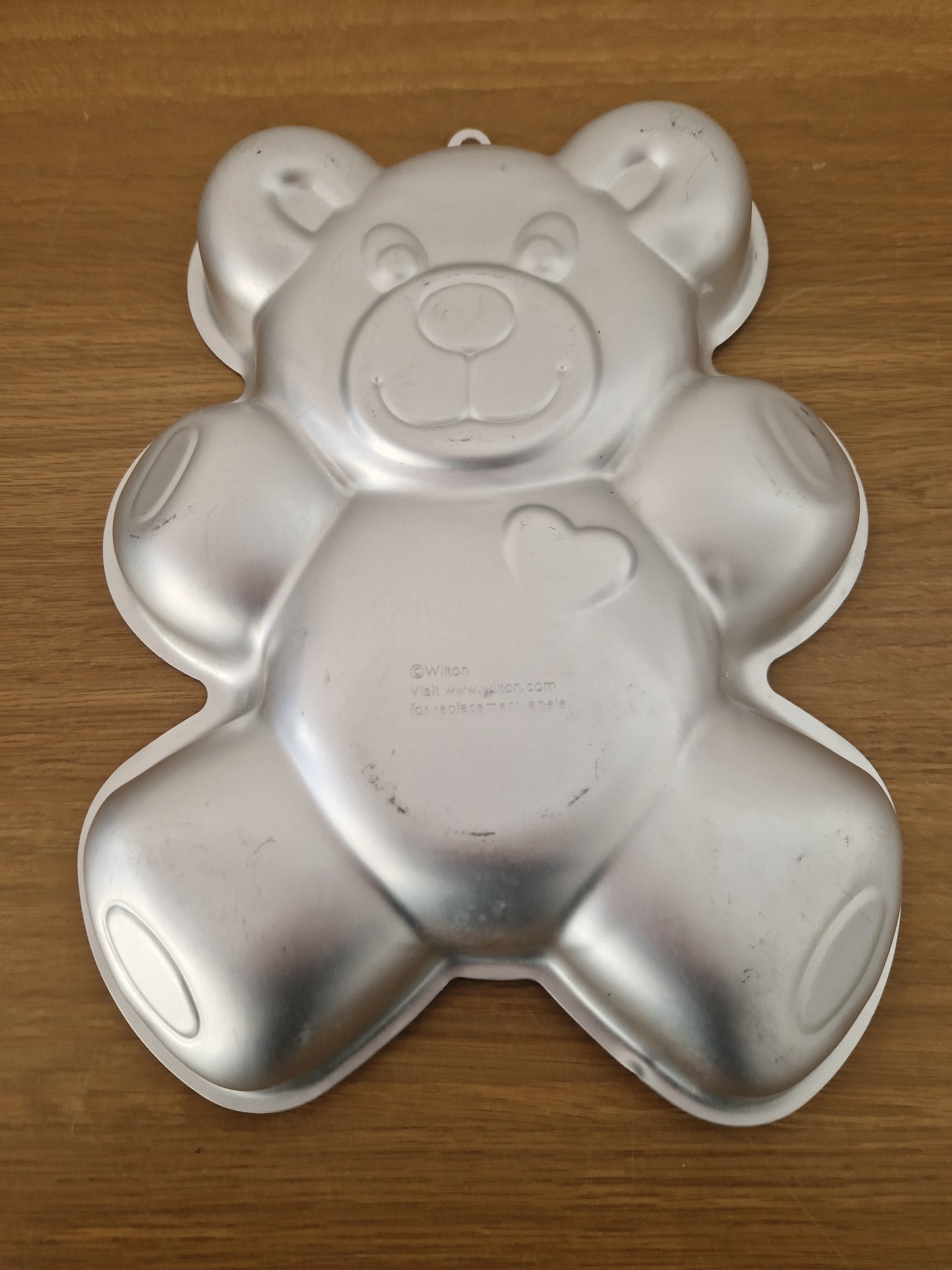 Teddy bear metal cake tin.