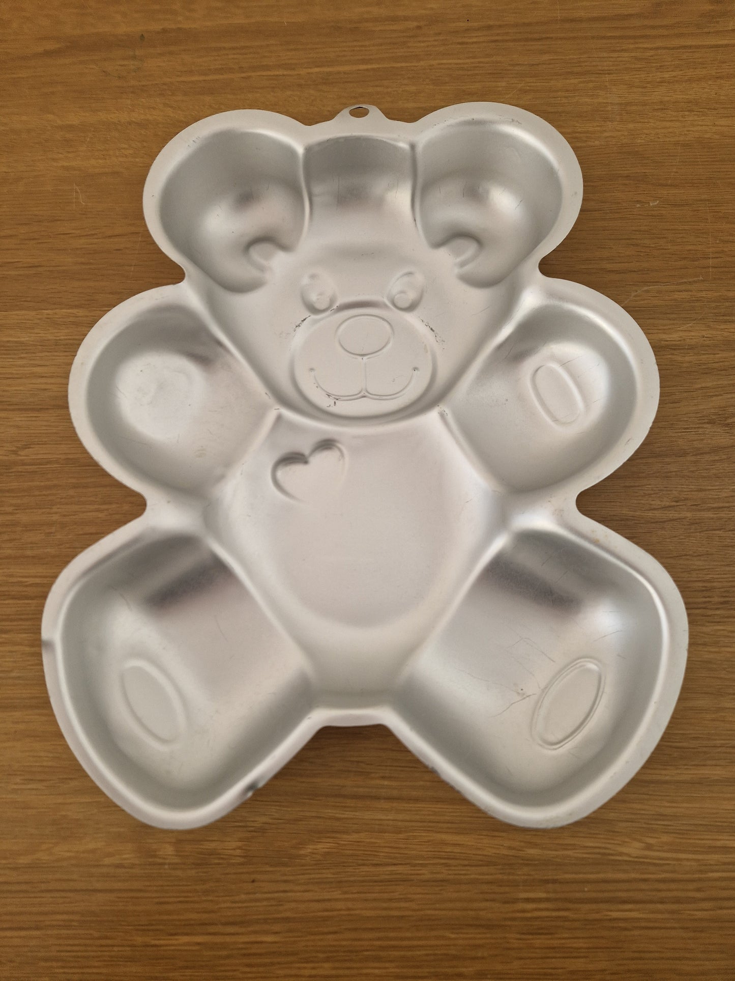 Teddy bear metal cake tin.