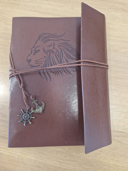 Leather scrap book or photo album with Lion design