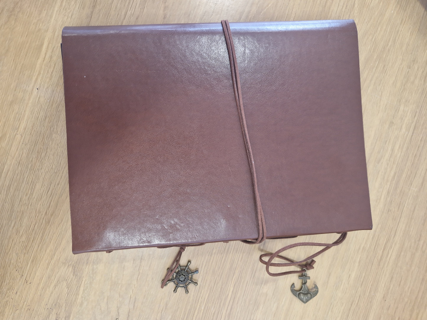 Leather scrap book or photo album with Lion design