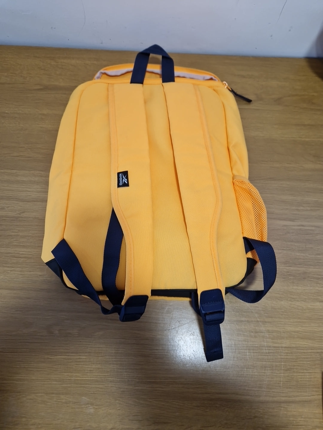 Yellow Reebok backpack with Ajustable Straps made with recycled materials