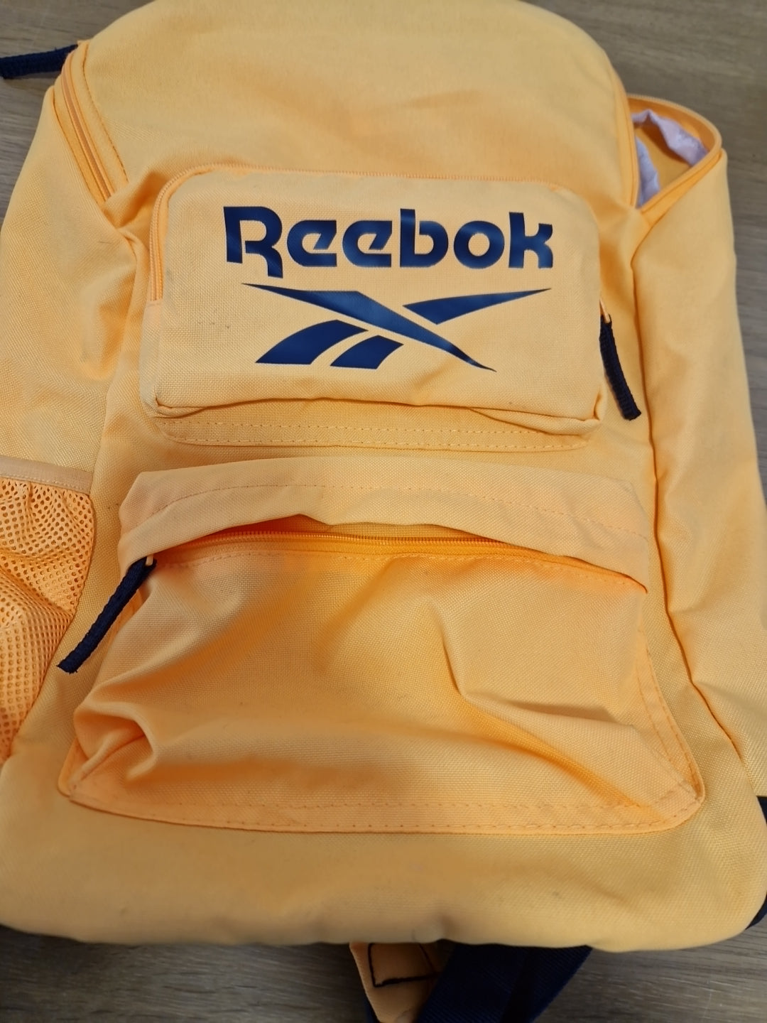 Yellow Reebok backpack with Ajustable Straps made with recycled materials