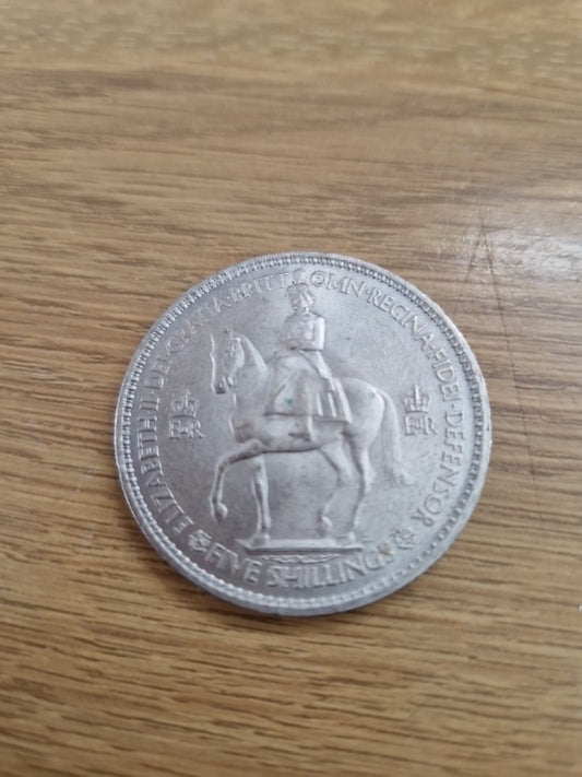 Queen Elizabeth  five shilling 1953 British coin.