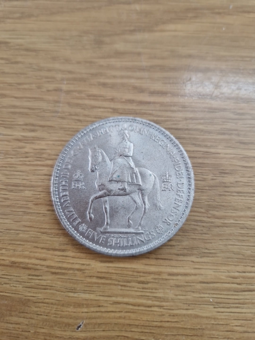 Queen Elizabeth  five shilling 1953 British coin.