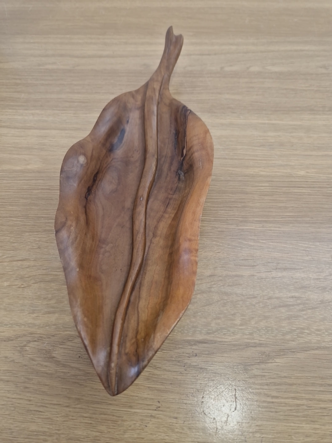 Wooden bowl in the shape of a leaf