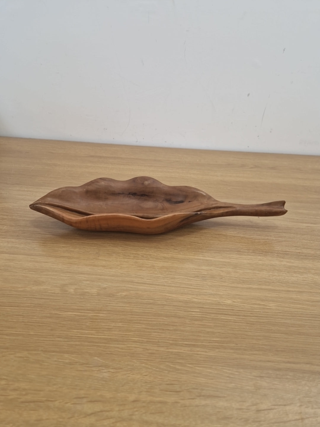 Wooden bowl in the shape of a leaf