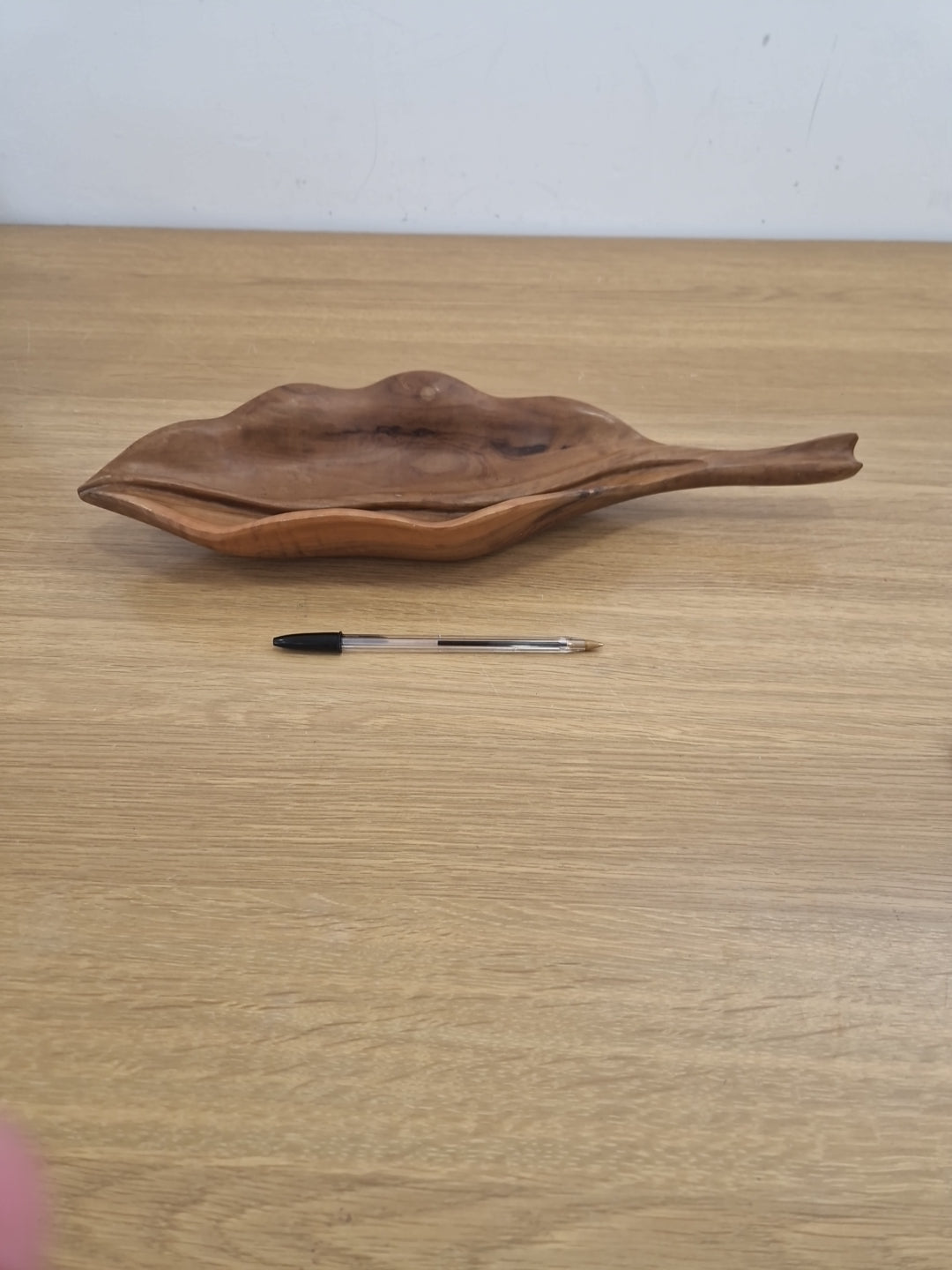 Wooden bowl in the shape of a leaf